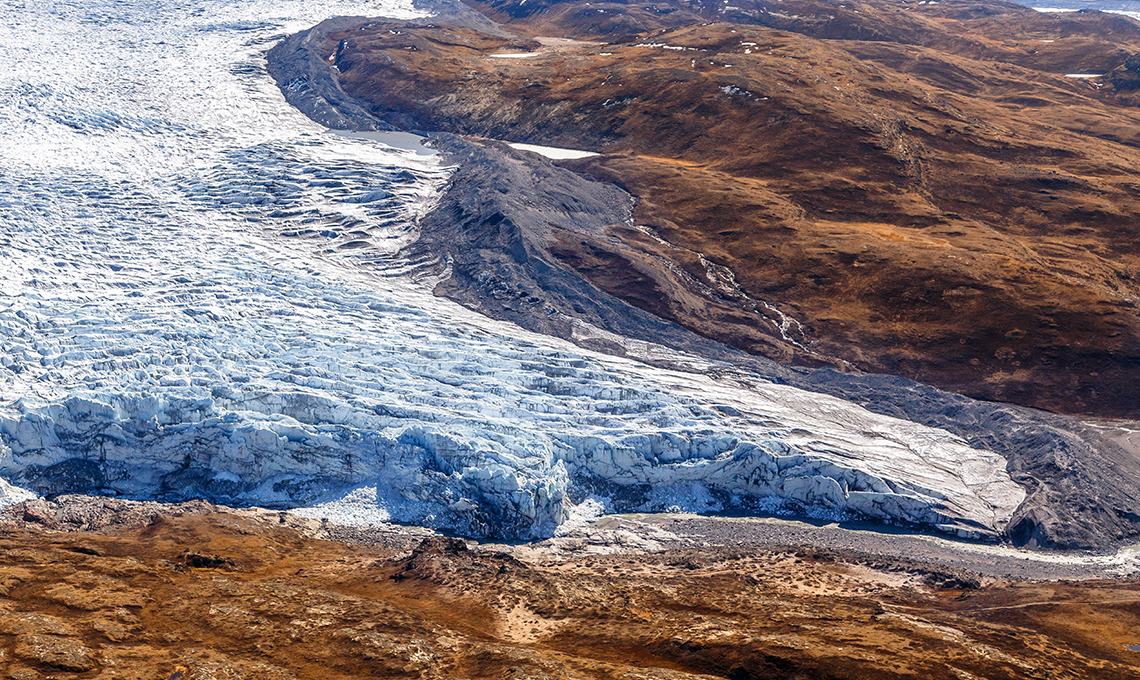 Greenlandic ice cap melting glacier with tundra aerial view, near Kangerlussuaq, Greenland